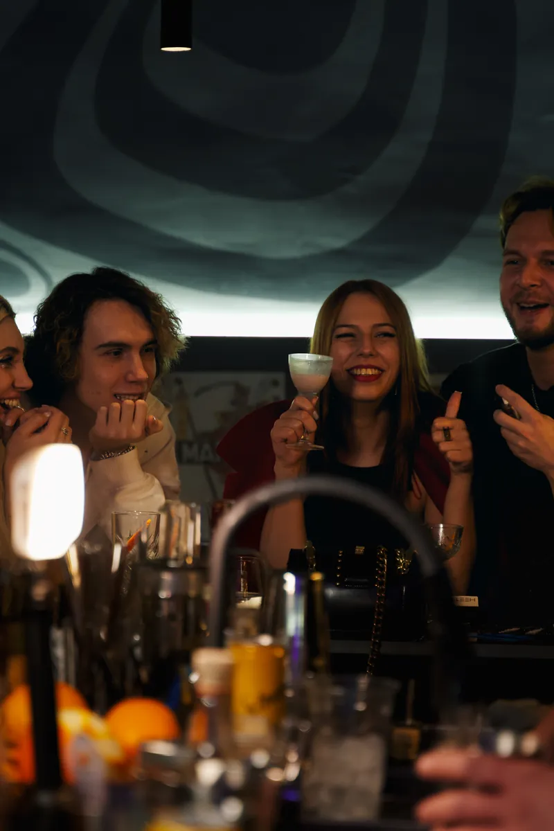 Group joy at Qube Bar — guests celebrating, Batumi